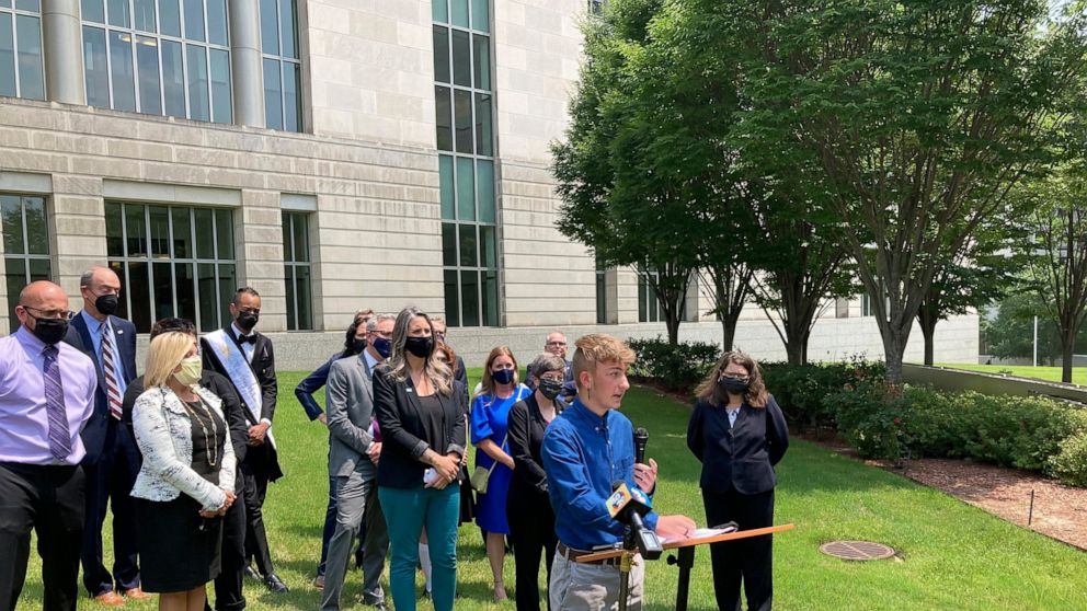 FILE - Dylan Brandt speaks at a news conference outside the federal courthouse in Little Rock, Ark., July 21, 2021. Brandt, a teenager, is among several transgender youth and families who are plaintiffs challenging a state law banning gender confirmi