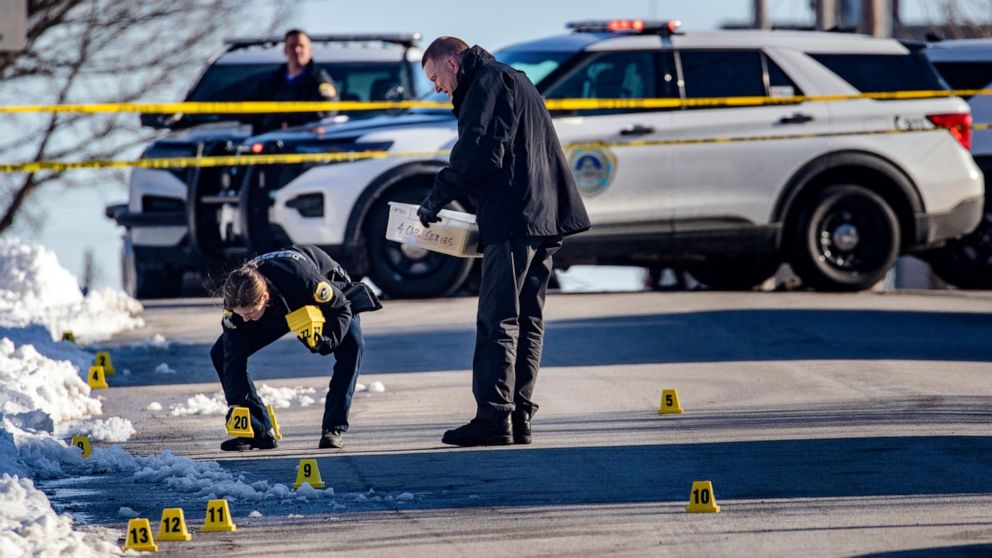 FILE - Police investigate a shooting outside of East High School in in Des Moines, Iowa, on March 7, 2022. From the start, the case stemming from a drive-by shooting death of a 15-year-old boy near a Des Moines high school has been among the most com