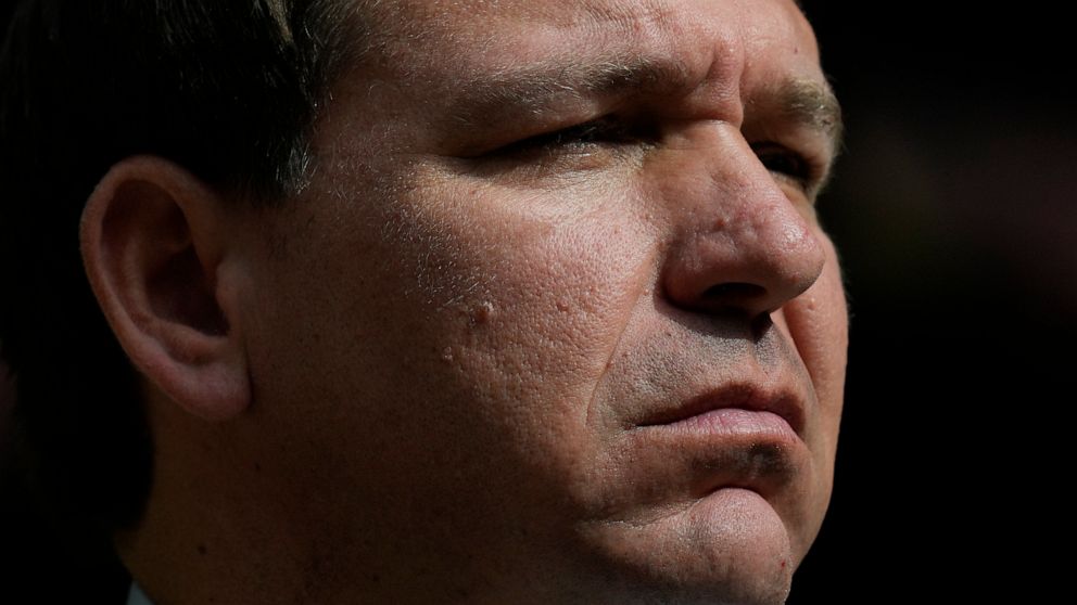 Florida Gov. Ron DeSantis listens during a news conference at Vizcaya Museum and Gardens, Tuesday, Feb. 1, 2022, in Miami. (AP Photo/Rebecca Blackwell)