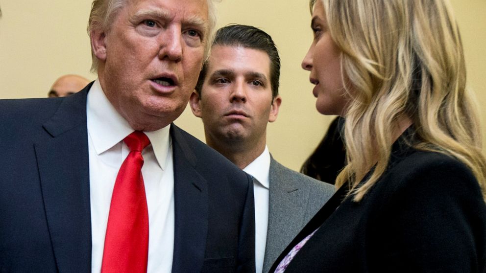 FILE - Donald Trump, left, Donald Trump Jr., center, and his daughter Ivanka Trump speak during the unveiling of the design for the Trump International Hotel in the The Old Post Office in Washington, on Sept. 10, 2013. In papers filed Monday, March 2