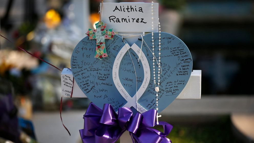 Alithia Ramirez's cross stands at a memorial site for the victims killed in this week's shooting at Robb Elementary School in Uvalde, Texas, Friday, May 27, 2022. (AP Photo/Dario Lopez-Mills)