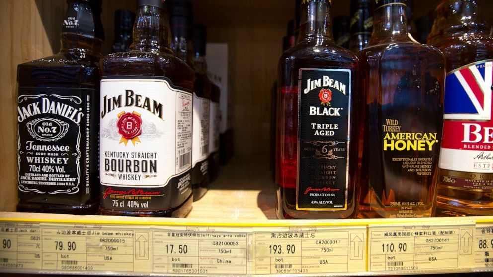 FILE - In this July 7, 2018 file photo whiskeys distilled and bottled in the U.S. are displayed for sale in a grocery store in Beijing. American whiskey absorbed some setbacks but showed resilience in the face of COVID-related clampdowns on bars and 