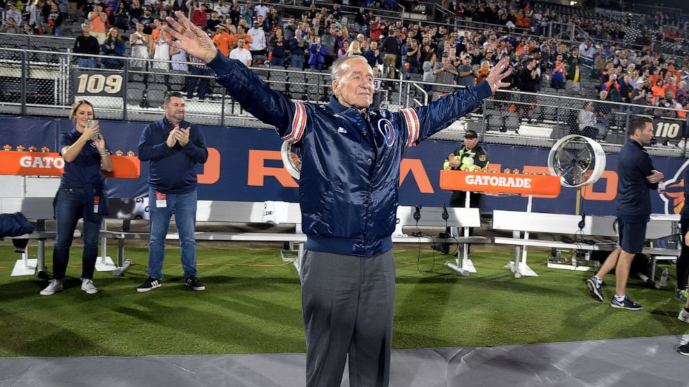 FILE - Apollo 7 astronaut Walter Cunningham acknowledges the crowd before an Alliance of American Football game between the Orlando Apollos and the Atlanta Legend, Feb. 9, 2019, in Orlando, Fla. Cunningham, the last surviving astronaut from the first