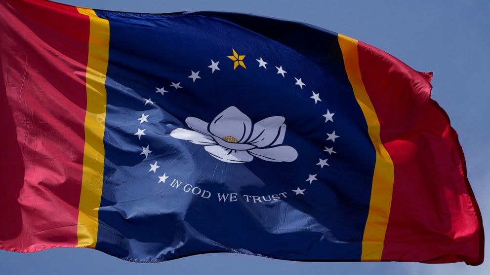 Voters will cast their ballot on Tuesday, Nov. 3 on whether to make the magnolia centered banner chosen by the Mississippi State Flag Commission, displayed outside the Old State Capitol Museum in downtown Jackson, Miss., Sept. 2, 2020, as the new sta