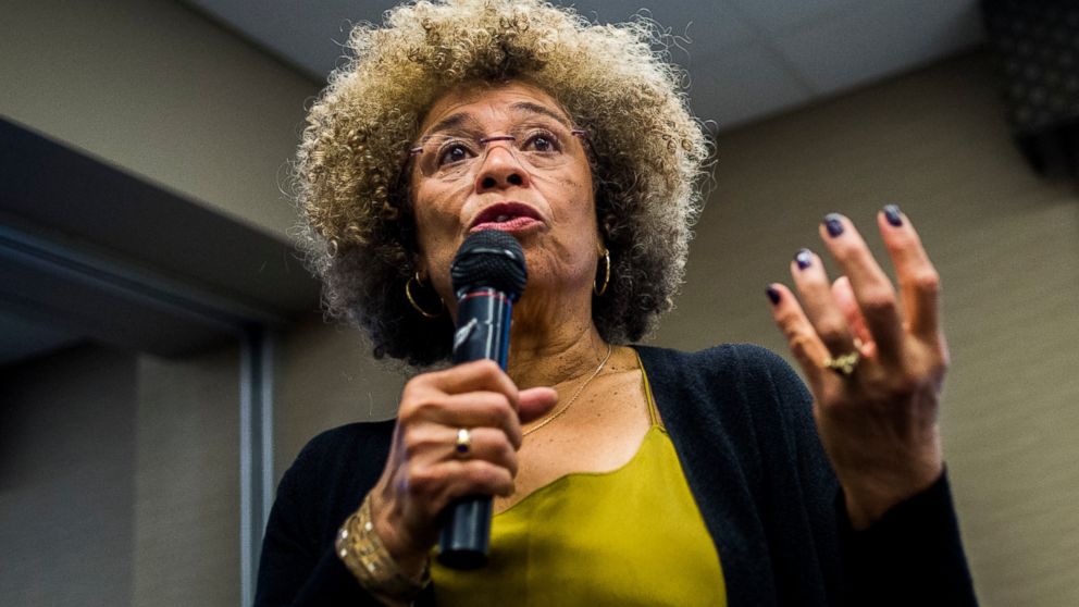 FILE- In this Feb. 19, 2015, file photo Angela Davis, author, educator and iconic civil rights activist, speaks during her visit to the University of Michigan-Flint, in Flint, Mich. The Birmingham Civil Rights Institute in Alabama announced Saturday,