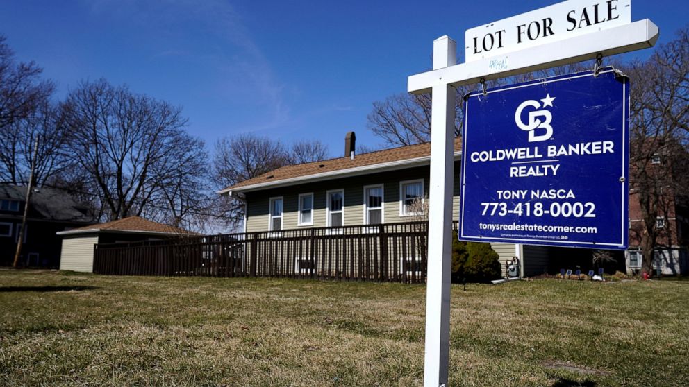 A "lot for sale" sign stands along side a housing lot in Des Plaines, Ill., Sunday, March 21, 2021. Mortgage rates rose slightly this week as new economic data continues to show strength in a recovering economy. Mortgage buyer Freddie Mac reports, Th