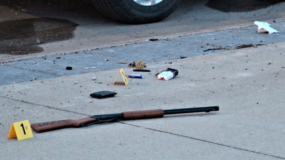 Items on the sidewalk at the scene of an officer-involved shooting at the foot of the Sixth Street bridge early Wednesday, April 7, 2021, in Waterloo, Iowa. In a lawsuit filed Thursday, Sept. 23, 2021, a man who was paralyzed when an Iowa police offi