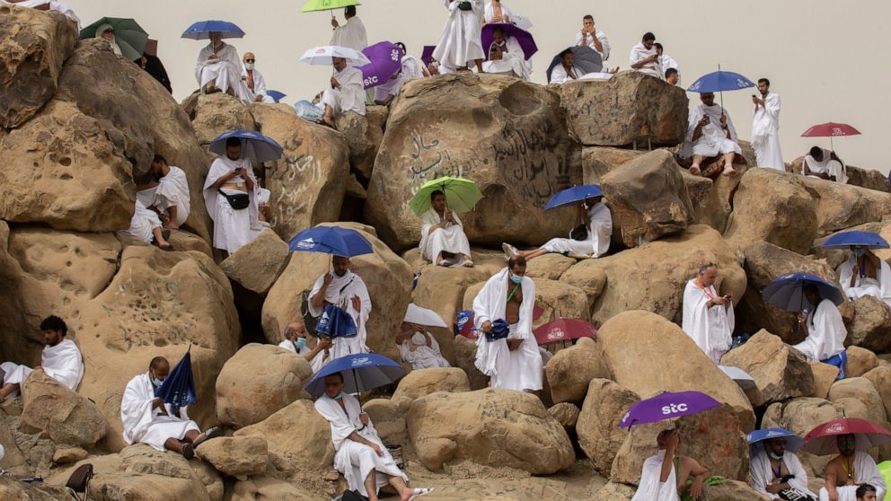 Muslim pilgrims pray on top of the rocky hill known as the Mountain of Mercy, on the Plain of Arafat, beside inscriptions which were left by pilgrims from previous years, during the annual hajj pilgrimage, near the holy city of Mecca, Saudi Arabia, M