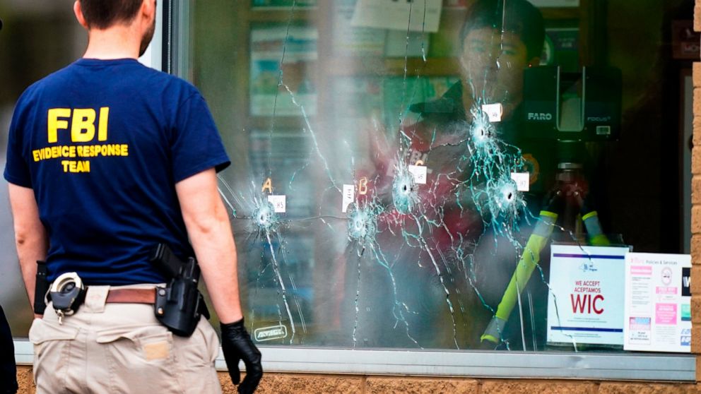 Investigators work the scene of a shooting at a supermarket in Buffalo, N.Y., Monday, May 16, 2022. (AP Photo/Matt Rourke)