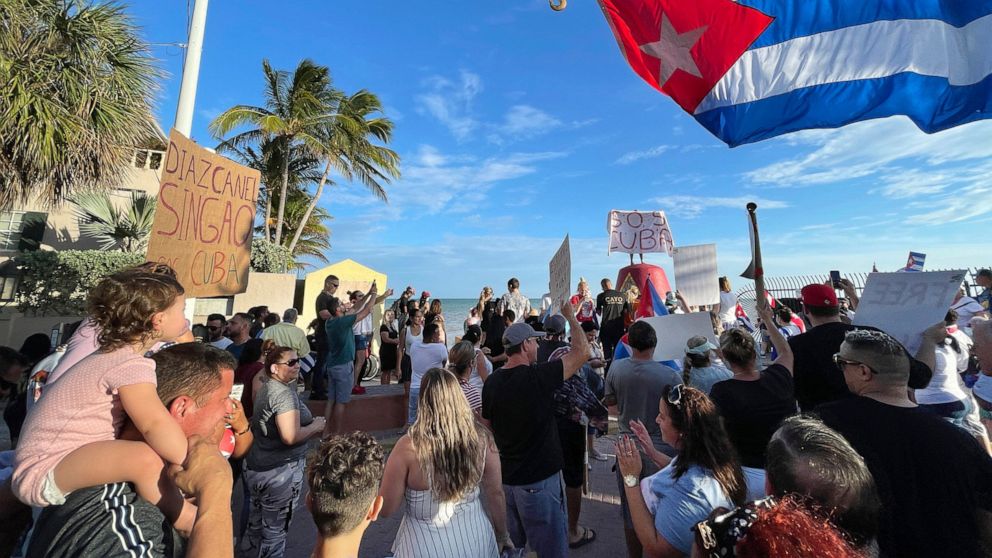 Roughly two hundred supporters of recent protests in Cuba gather at the Southernmost Point buoy in Key West, Florida, on July 13, 2021. Carrying signs demanding freedom for the Cuban people, the crowd paraded down Duval Street following an over-sized