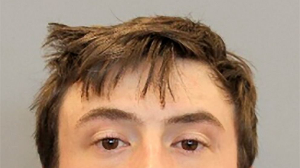 In this undated booking photo provided by the Houston, Texas Police Department shows Ryan Mitchell. Mitchell who is accused of stabbing a police dog Saturday, was free on bond and now on the run Tuesday, Jan. 25, 2022, after police alleged he fled fr