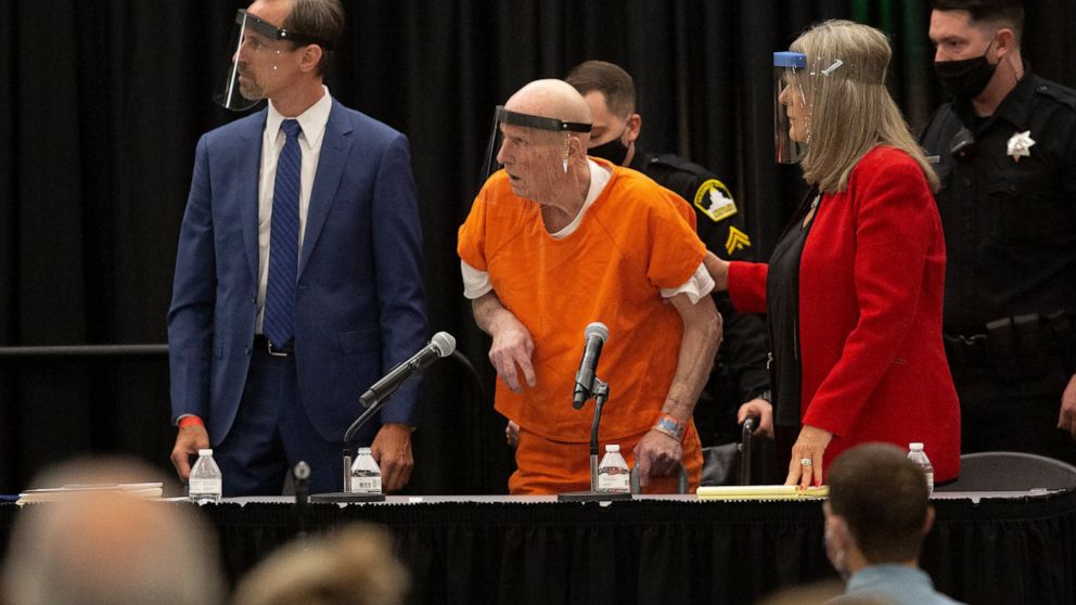 Joseph James DeAngelo, center, charged with being the Golden State Killer, his helped up by his attorney, Diane Howard, as Sacramento Superior Court Judge Michael Bowman enters the courtroom in Sacramento, Calif. Monday June 29, 2020. DeAngelo, 74, i