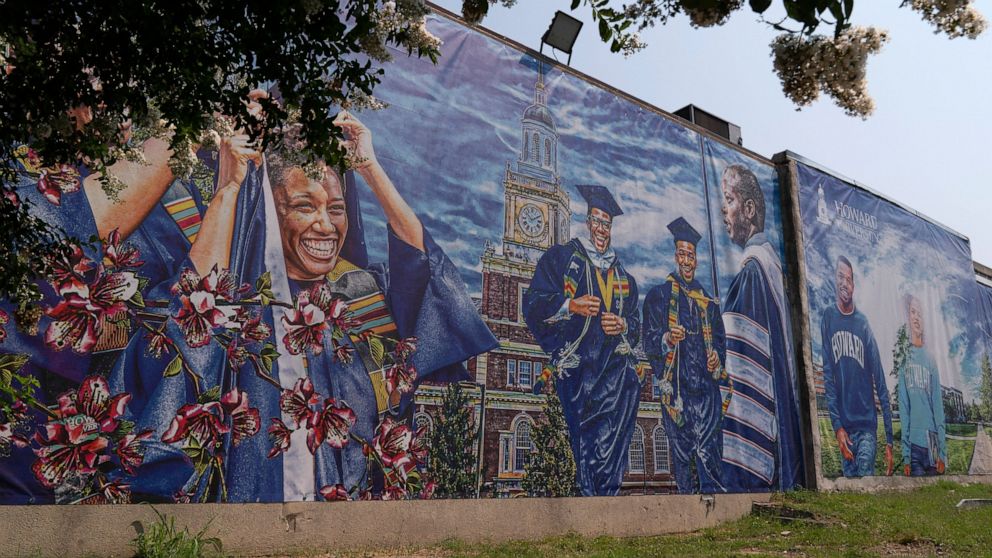 FILE - A graduation themed printed mural is seen on the Howard University campus, July 6, 2021, in Washington. At least six historically Black universities in five states and the District of Columbia were responding to bomb threats Monday, Jan. 31, 2