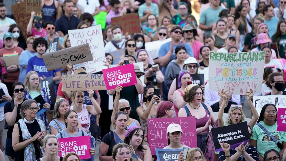 FILE - Abortion rights protesters attend a rally outside the state Capitol in Lansing, Mich., on June 24, 2022, following the United States Supreme Court's decision to overturn Roe v. Wade. Judge Elizabeth Gleicher, of the Court of Claims, on Wednesd