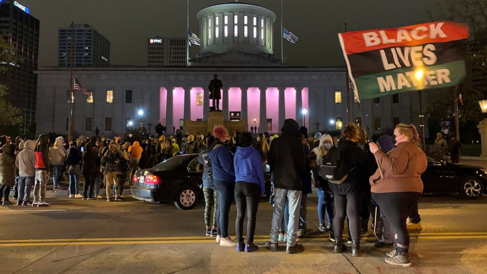 A crowd gathers in front of the Ohio Statehouse during a protest Tuesday, April 20, 2021, in Columbus, Ohio. Earlier Tuesday, police shot and killed a teenage girl in Columbus just as the verdict was being announced in the trial for the killing of Ge
