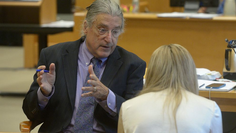 Norman Pattis, attorney for Alex Jones, in discussion with Brittany Paz, a Connecticut lawyer hired by Jones to testify about his companies' operations, during the Alex Jones Sandy Hook defamation damages trial in Superior Court in Waterbury, Conn.,,