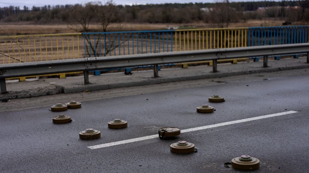 Anti tank mines are displayed on a bridge in Bucha, in the outskirts of Kyiv, Ukraine, Saturday, April 2, 2022. (AP Photo/Rodrigo Abd)
