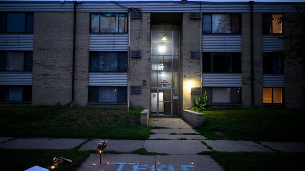 Tekle Sundberg's name is written in chalk during a vigil for 20-year old Sundberg Thursday, July 14, 2022 outside the apartment building where he was killed by Minneapolis Police in Minneapolis. Minneapolis police officers shot and killed Sundberg ea