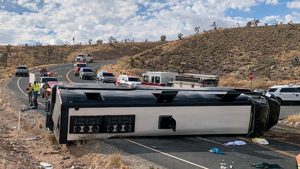 This photo provided by the Mohave County Sheriff's Office shows a Las Vegas-based tour bus that crashed, Jan. 22, 2021, in Dolan Springs, Ariz. A crash report on the tour bus that flipped on the way to the west end of the Grand Canyon, killing one pa