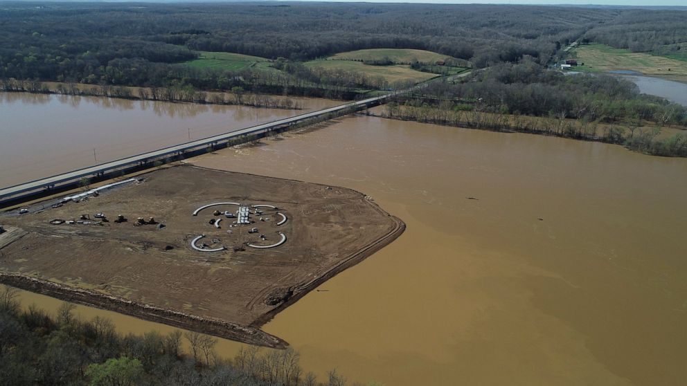This photo taken on March 29, 2001, shows a light-colored plume extending from a controversial sand and gravel mine on the Duck River in Tennessee. Volunteer Sand and Gravel has been ignoring a cease and desist letter for months, and opponents say it