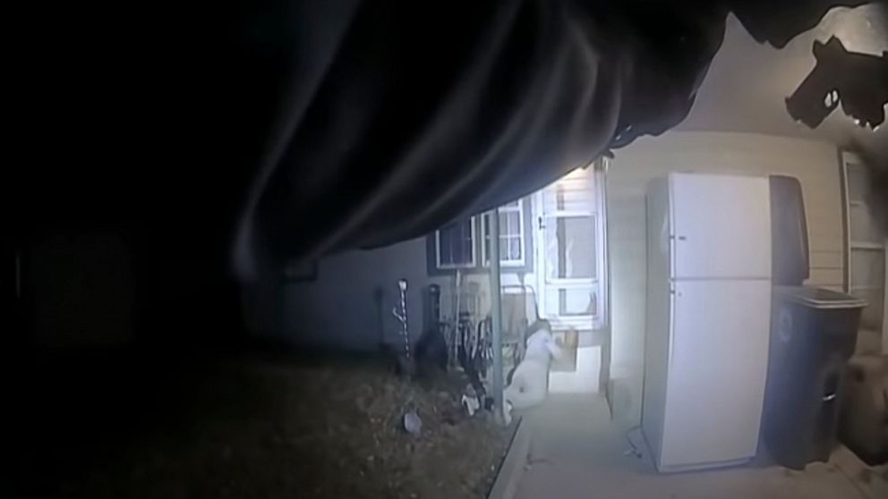 This image from police body cam video provided by the City of Lawton, OKla., shows police approaching Quadry Sanders after being shot by police on Dec. 5, 2021. Two former Oklahoma police officers were charged with first-degree manslaughter on Friday