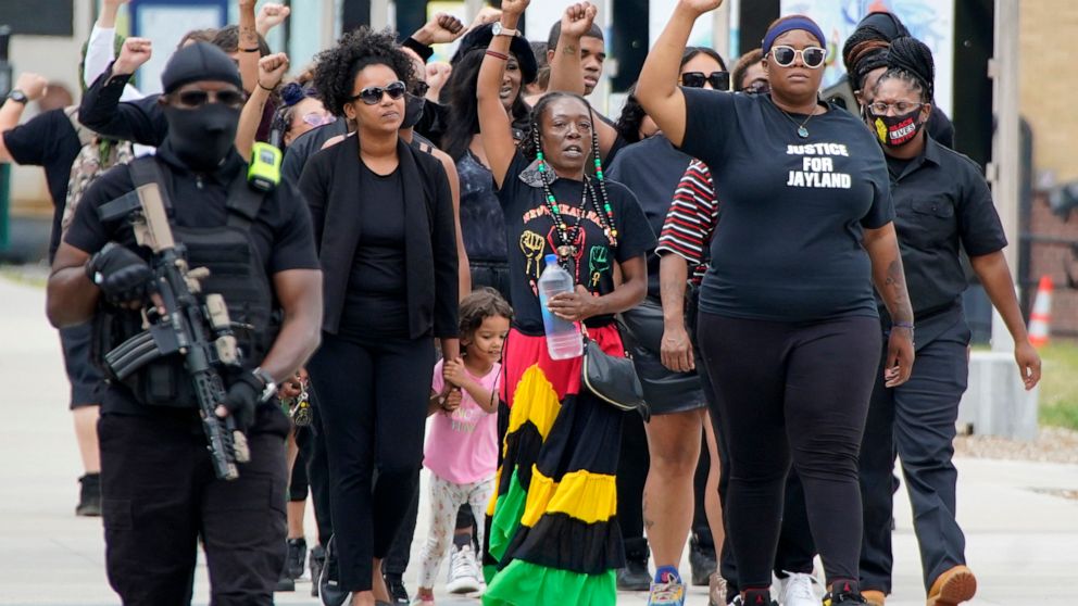 A group arrives to pay their respects at a memorial service for Jayland Walker, Wednesday, July 13, 2022, at the Akron Civic Center in Akron, Ohio. Walker, a Black motorist, was killed by Akron police in a hail of gunfire after a car and foot chase t