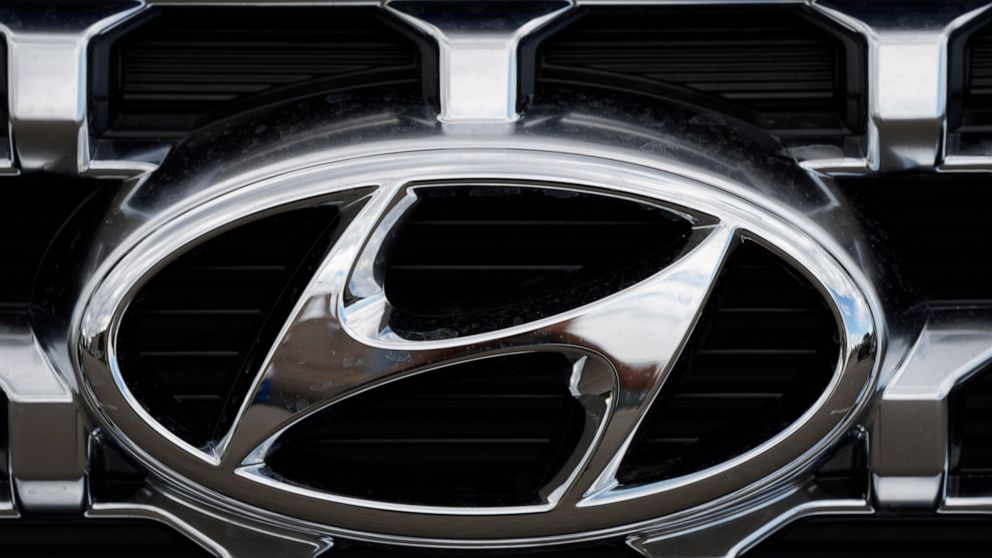 FILE - The Hyundai company logo is displayed Sunday, Sept. 12, 2021, in Littleton, Colo. Hyundai and Kia are telling owners, Tuesday, Aug. 23, 2022, of some large SUVs to park them outdoors and away from structures after a series of fires involving t