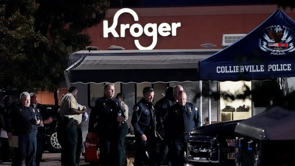 Law enforcement personnel work in front of a Kroger grocery store as an investigation goes into the night following a shooting earlier in the day on Thursday, Sept. 23, 2021, in Collierville, Tenn. Police say a gunman attacked people in the store and