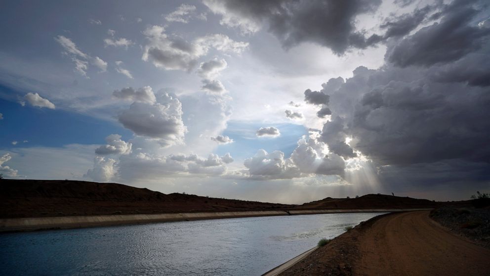 FILE - Water flows along the All-American Canal Saturday, Aug. 13, 2022, near Winterhaven, Calif. The canal conveys water from the Colorado River into the Imperial Valley. California water agencies that rely on the Colorado River, said Wednesday, Oct