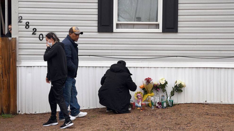 Mourners organize a memorial on Monday, May 10, 2021, outside a mobile home in Colorado Springs, Colo., where a shooting at a party Sunday took place. A shooting at a birthday party inside a trailer park home that killed six people before the gunman 