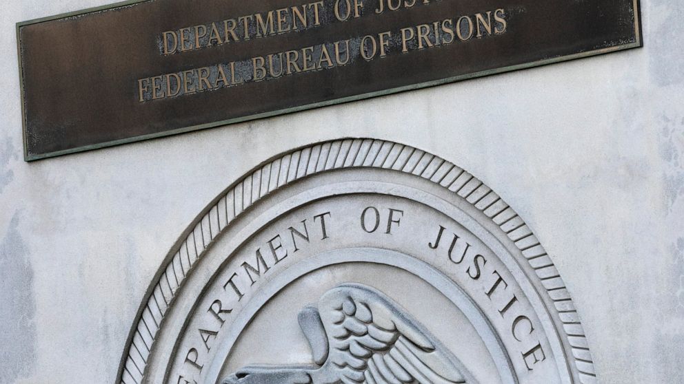 FILE - A sign for the Department of Justice Federal Bureau of Prisons is displayed at the Metropolitan Detention Center in the Brooklyn borough of New York, July 6, 2020. A federal judge in Texas on Tuesday, Dec. 13, 2022, rejected Oklahoma’s attempt
