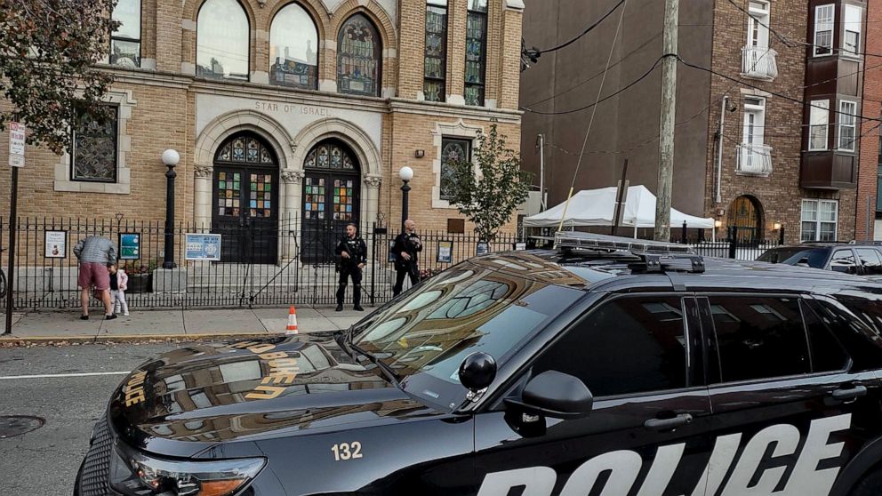 Hoboken Police officers stand watch outside the United Synagogue of Hoboken, Thursday, Nov. 3, 2022, in Hoboken, N.J. The FBI says it has received credible information about a threat to synagogues in New Jersey. The FBI's Newark office released a sta