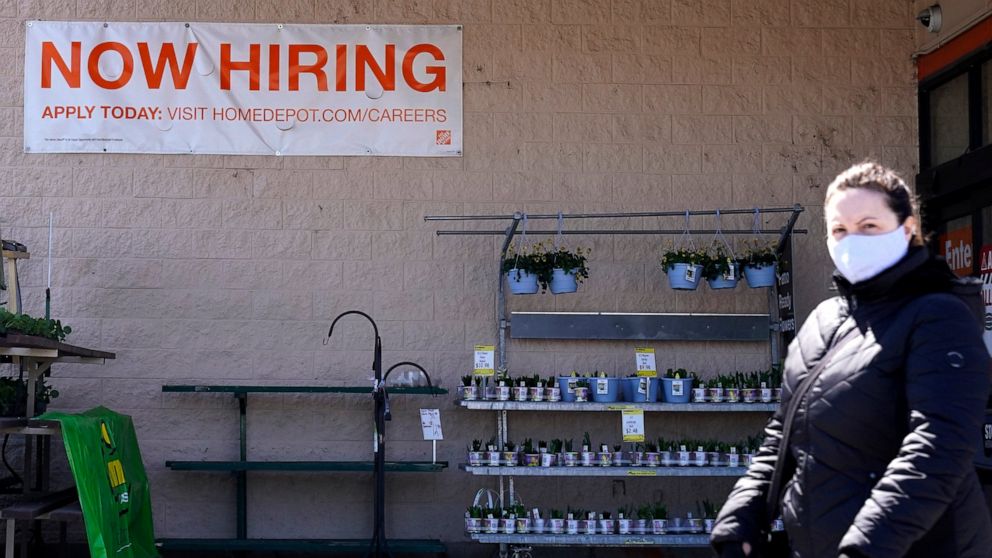 A hiring sign is seen outside home improvement store in Mount Prospect, Ill., Friday, April 2, 2021. America's employers unleashed a burst of hiring in March, adding 916,000 jobs in a sign that a sustained recovery from the pandemic recession is taki