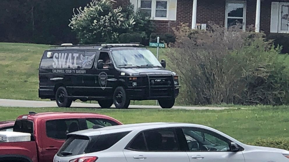In this photo provided by WJZY, a tactical van from Caldwell County, North Carolina, sits on stand-by at a staging area in Boone, N.C., on Wednesday, April 28, 2021. Law enforcement agencies responded to a standoff in Boone in which two Watauga Count