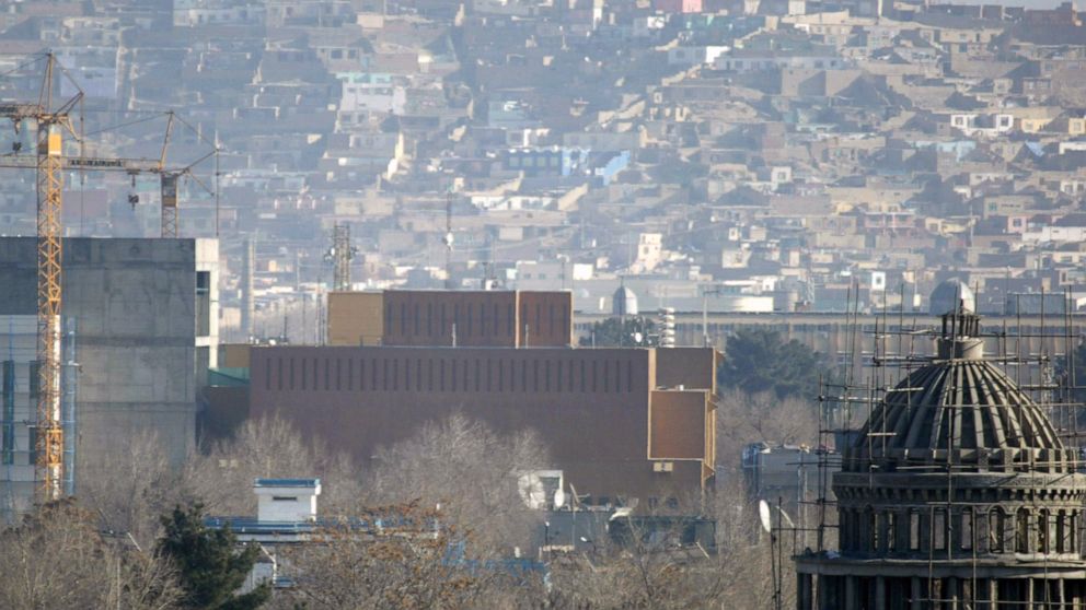 FILE - This Dec. 25, 2013, filer, photo shows a general view of the U.S. Embassy in Kabul, Afghanistan after it was hit by rocket fire in Kabul, Afghanistan. The U.S. State Department says Saturday, June 20, 2020 that COVID-19 infections have been re
