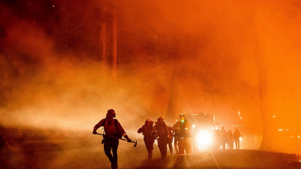 Firefighters battle the Mosquito Fire burning on Michigan Bluff Rd. in unincorporated Placer County, Calif., on Wednesday, Sept. 7, 2022. (AP Photo/Noah Berger)