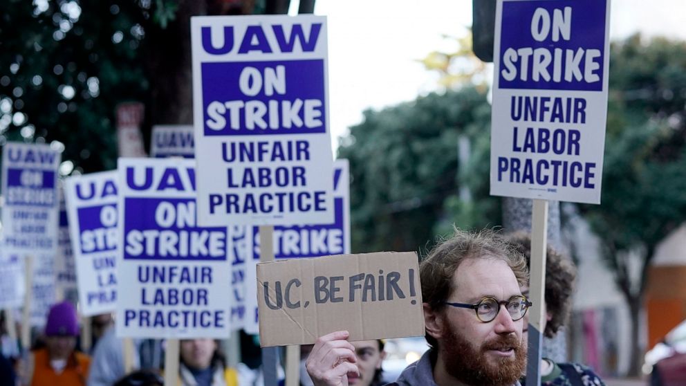 FILE - People take part in a protest outside of University of California San Francisco medical offices in San Francisco, Monday, Nov. 14, 2022. On Tuesday, Nov. 29, 2022, postdoctoral scholars and academic researchers reached a tentative labor agreem