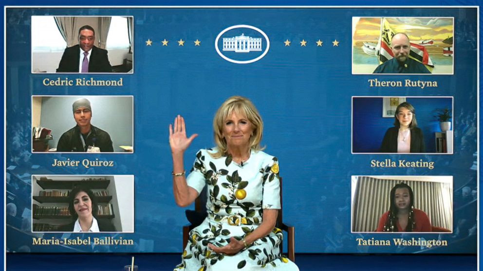 In this image from video provided by The White House, first lady Jill Biden waves to her virtual guests on Wednesday, April 28, 2021, ahead of the joint session of Congress and President Joe Biden's speech in Washington. Guests watching virtually wil