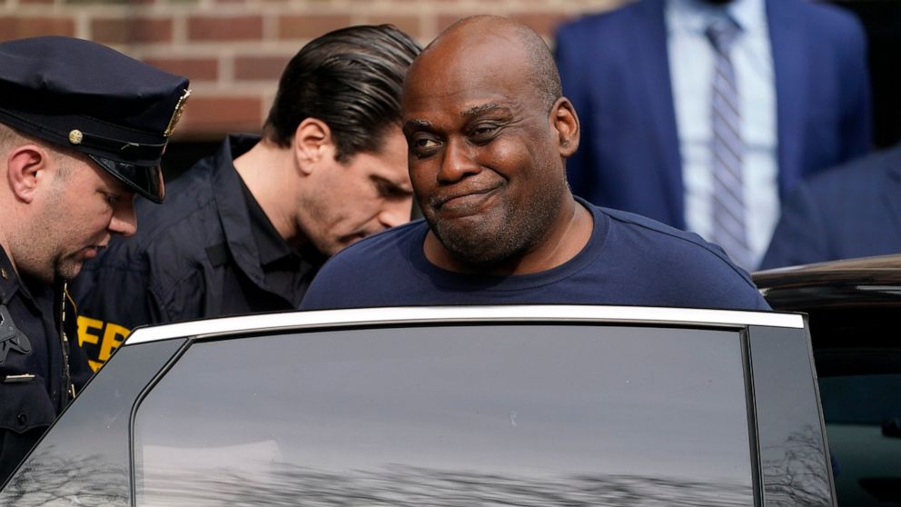 FILE - Law enforcement officials lead subway shooting suspect Frank R. James, 62, away from a police station and into a vehicle in New York on April 13, 2022. Defense attorneys claimed in a court filing Thursday, April 28, 2022, that agents unexpecte