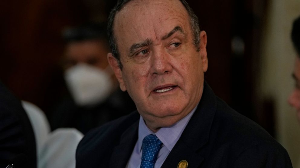 FILE - Guatemalan President Alejandro Giammattei meets U.S. Secretary of Homeland Security Alejandro Mayorkas at the Presidential House offices in Guatemala City, Tuesday, July 6, 2021. Guatemala has hired on Jan. 13, 2022, for $900,000 a major suppo