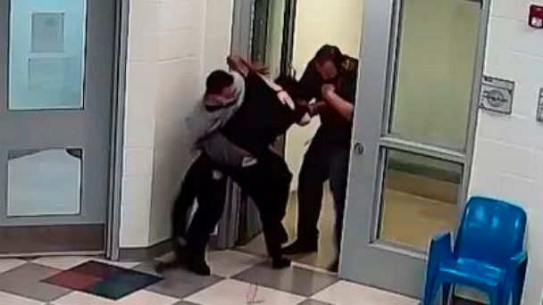 This still image from a security camera provided by Sedgwick County shows Cedric "CJ" Lofton struggling with staff on Sept. 24, 2021 at the Sedgwick County Juvenile Intake and Assessment Center in Wichita, Kan. Sedgwick County released 18 video clips