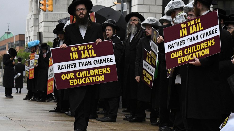 Members of the ultra-Orthodox and Hasidic Jewish communities hold a protest before a Board of Regents meeting to vote on new requirements that private schools teach English, math science and history to high school students on Monday, Sept. 12, 2022, 