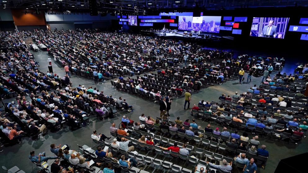 FILE - In this June 16, 2021, file photo, people attend the morning session of the Southern Baptist Convention annual meeting in Nashville, Tenn. A top Southern Baptist Convention administrator is resigning after weeks of internal division over how b