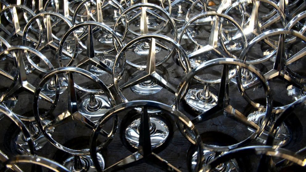 FILE - Mercedes stars, are on display at the Daimler-Benz factory in Sindelfingen, southern Germany, Feb. 1, 2011. Just as the global auto industry was starting the long road trip back to normal after pandemic factory shutdowns and a computer chip sh
