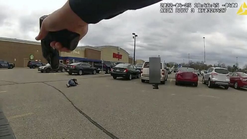 In this image taken from police body camera video released by the East Lansing Police, DeAnthony VanAtten lays on the ground after being shot by East Lansing, Mich., police on April 25, 2022, while responding to a call about a shopper with a gun. Pol