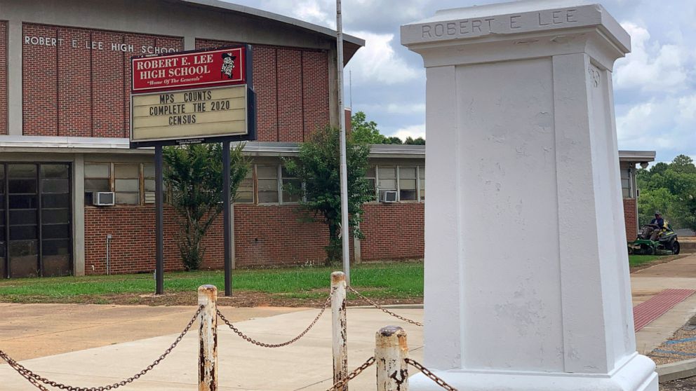 A pedestal that held a statue of Robert E. Lee stands empty outside a high school named for the Confederate general in Montgomery, Ala. on Tuesday, June 2, 2020. Four people were charged with criminal mischief after someone removed the statue amid na