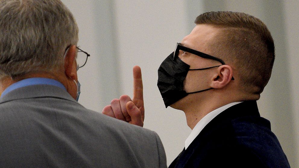 Volodymyr Zhukovskyy of West Springfield, Mass., gestures as the not guilty verdict is read while standing with his attorney, Steve Mirkin, at Coos County Superior Court in Lancaster, N.H., Tuesday, Aug. 9, 2022. The commercial truck driver was charg