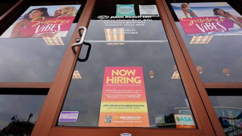 A Now Hiring sign at a business in Richmond, Va., Wednesday, June 2, 2021. U.S. employers posted a record 9.3 million job openings in April as the U.S. economy reopens at break-neck speed. Openings were up 12% from 8.3 million in March. (AP Photo/Ste