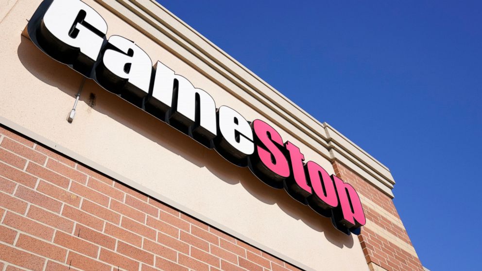 FILE - In this Thursday, Jan. 28, 2021, file photo, a GameStop sign is seen above a store, in Urbandale, Iowa. The U.S. stock market certainly shook when hundreds of thousands of regular people suddenly piled into GameStop earlier in 2021, driving it
