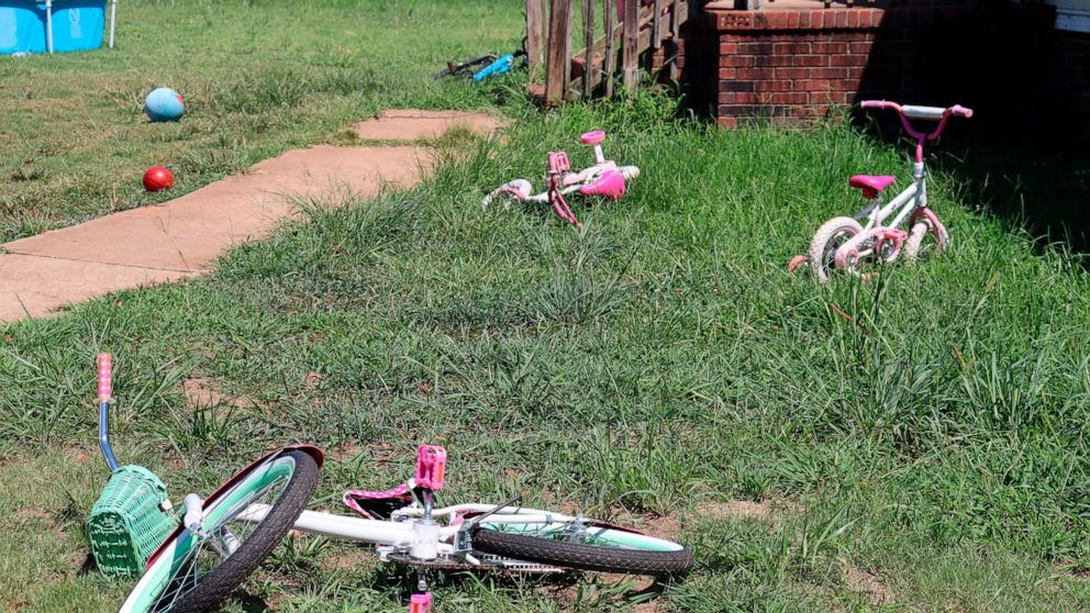 Bicycles belonging to some of Kesha Tate's nine children still line the front yard of her home on Thursday, Sept. 1, 2022, in Gaffney, S.C. Tate's family is seeking justice for her, after she was killed by a neighbor who was intoxicated and making ta
